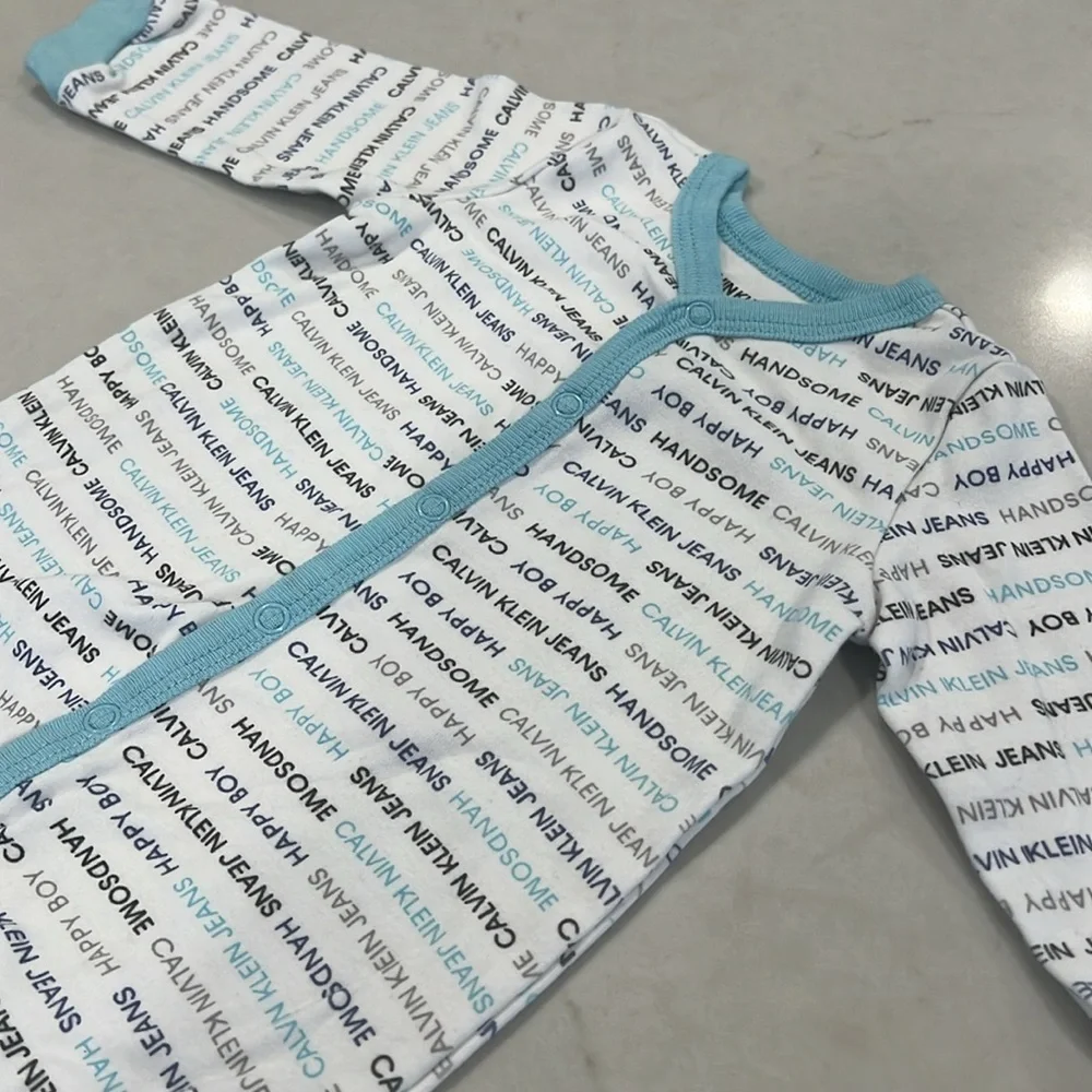 Calvin Klein Jeans baby footed coverall, never worn, size 3/6 months.